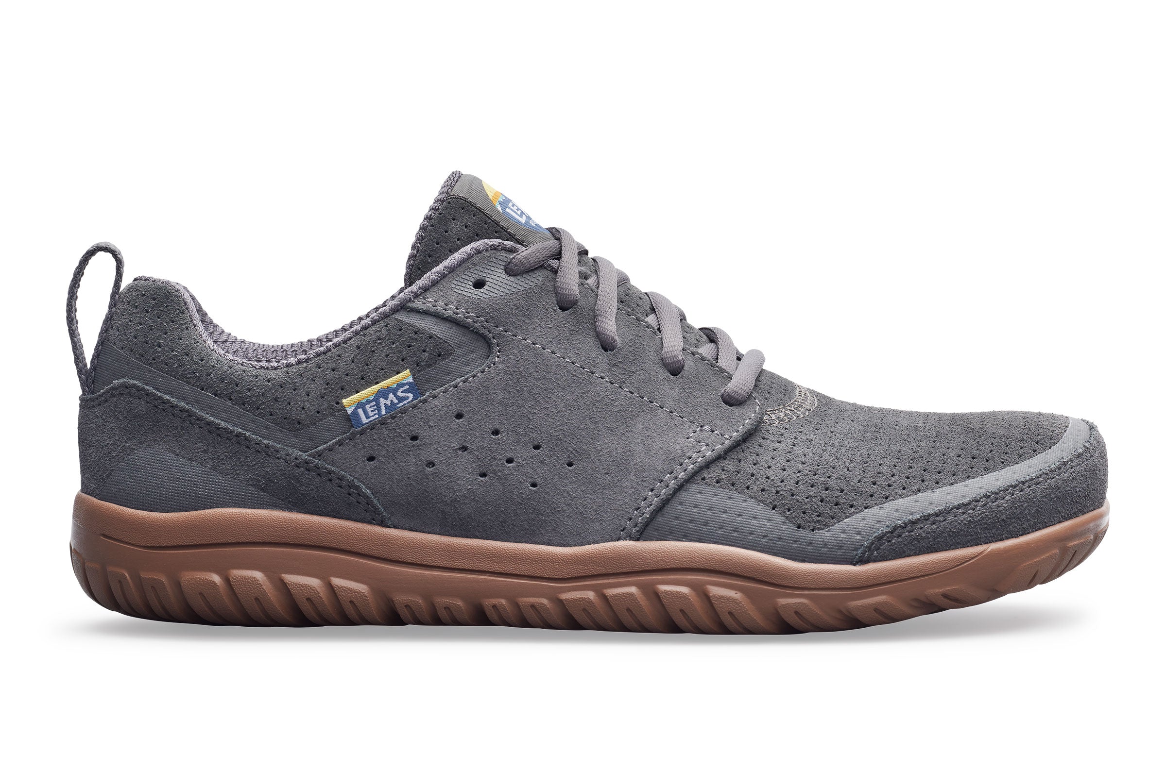 Gray sneaker with brown sole on a white background