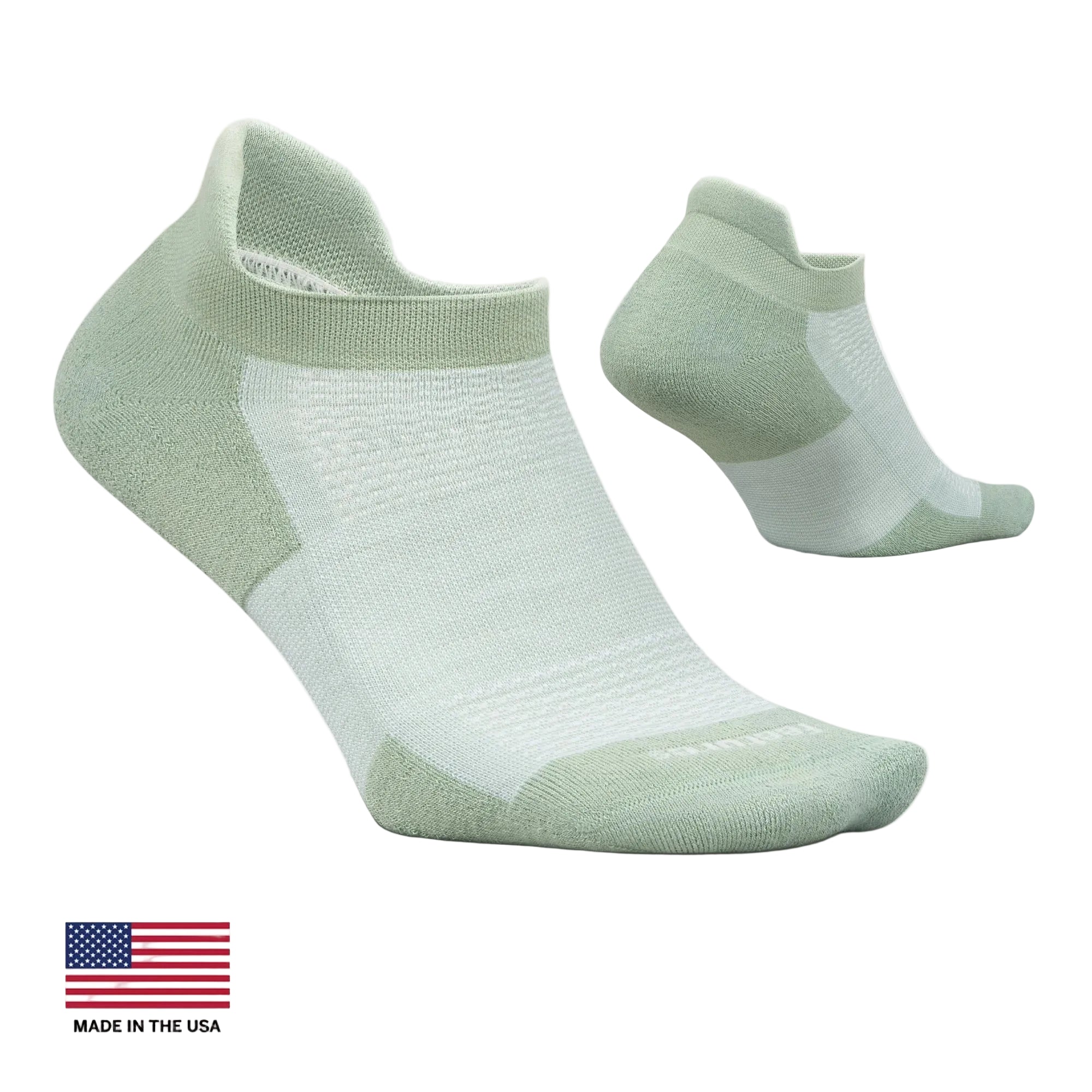A pair of low-cut athletic socks in a pale sage green and white colorway, shown on a light cream background with a 'Made in the USA' flag graphic in the bottom-left corner.