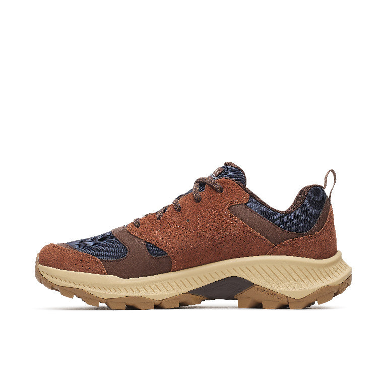 A brown and navy blue athletic sneaker with a chunky beige midsole and a brown outsole, shown from a side profile view on a white background.