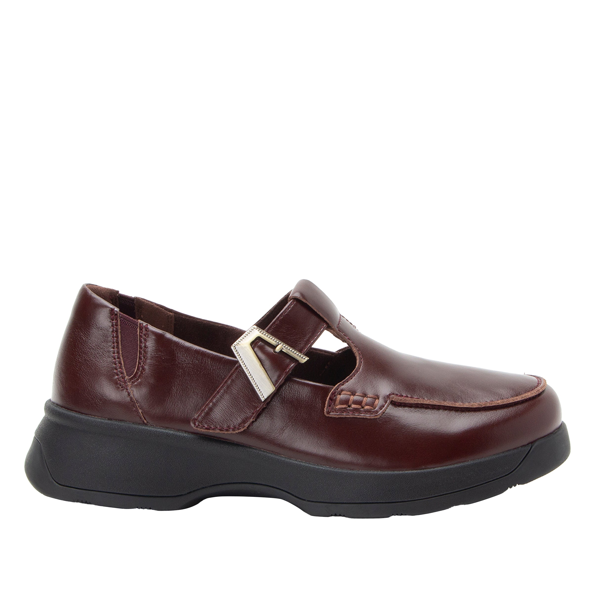 A dark brown leather slip-on shoe with a silver buckle strap and a thick black platform sole, shown from a side profile on a white background.