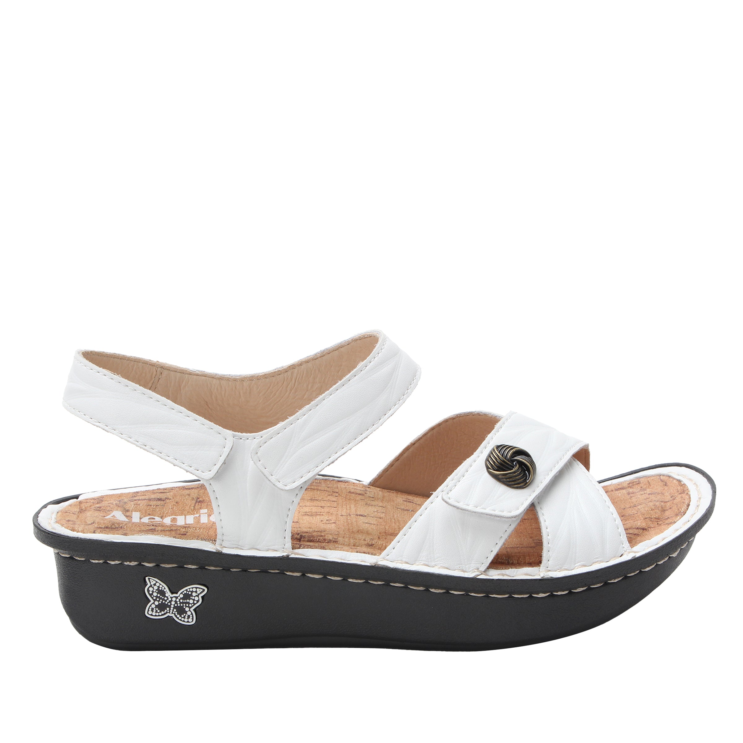 White sandal with a black sole on a white background