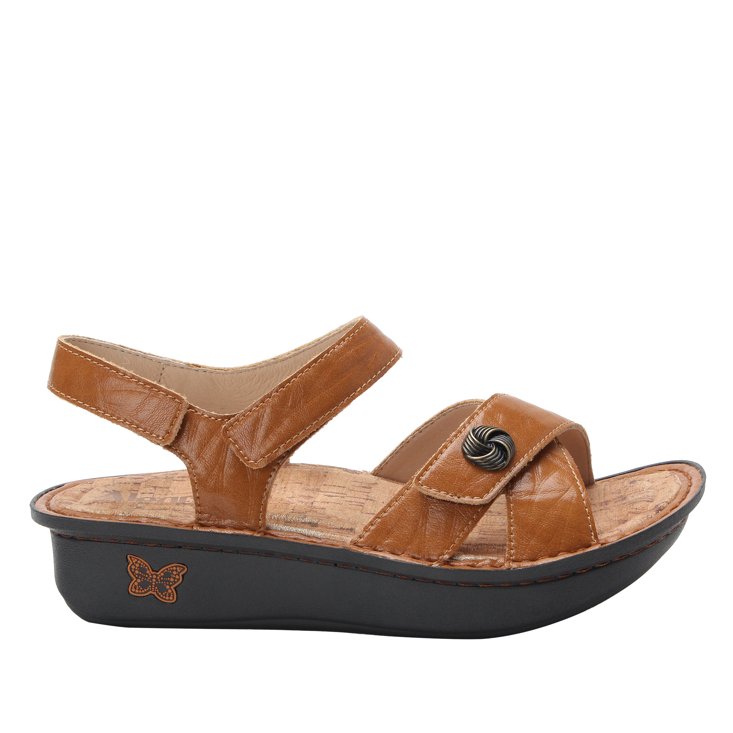 Brown sandal with a black sole on a white background