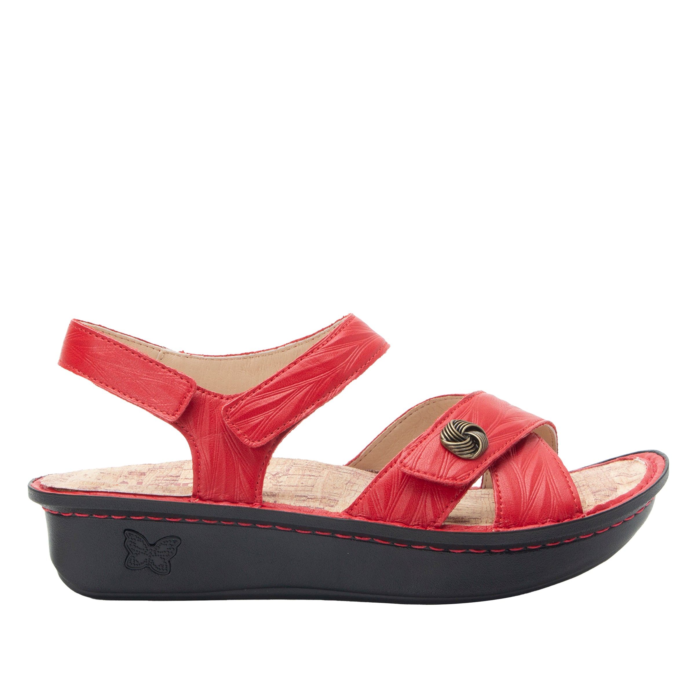 Red sandal with a black sole on a white background