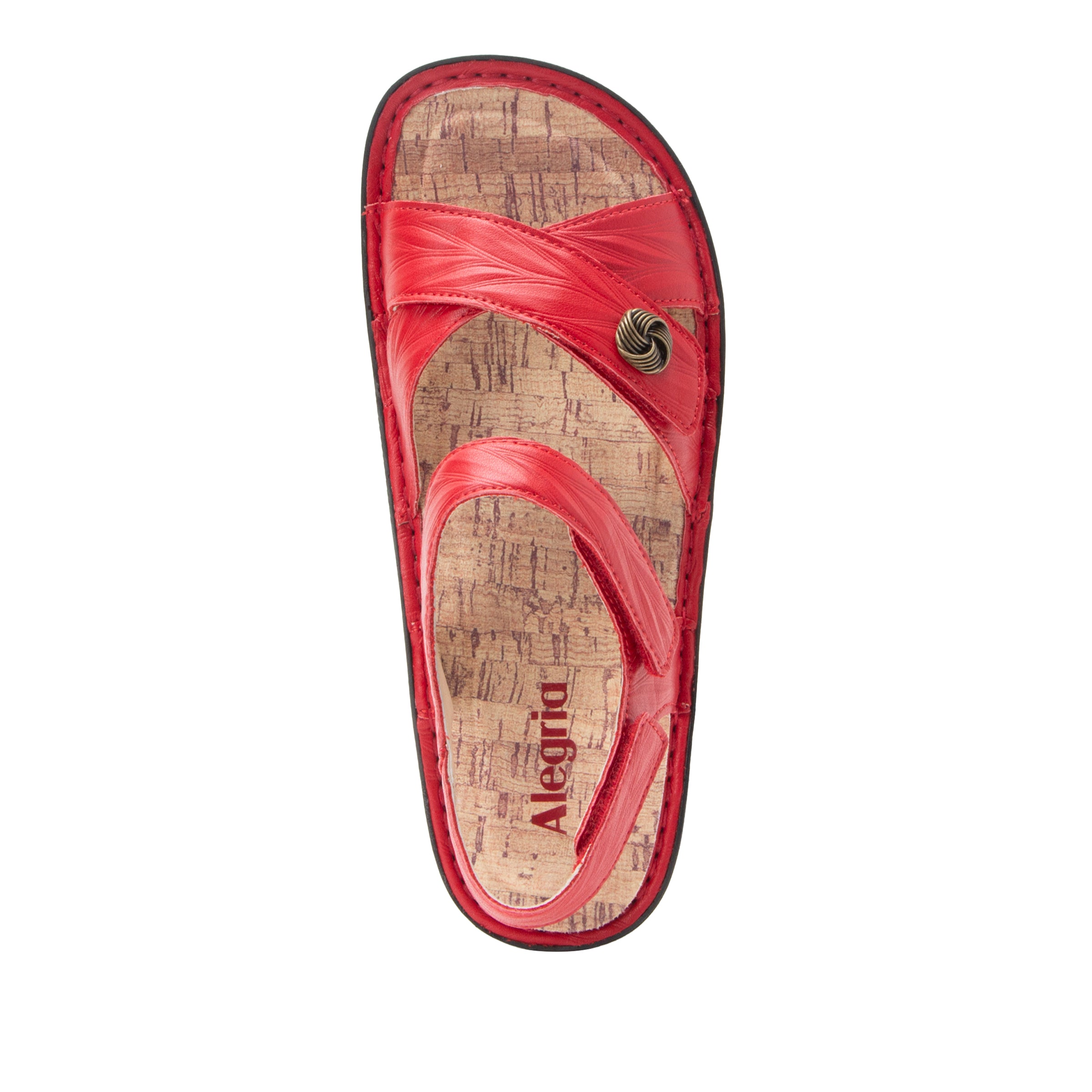 Red sandal with cork-like texture on a white background