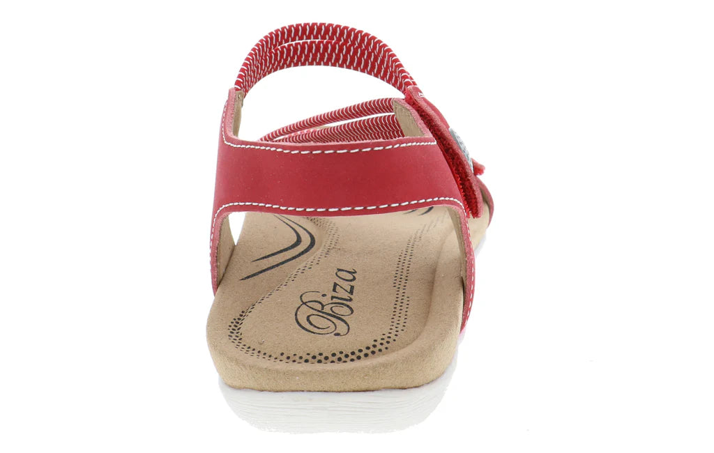 Red sandal with a visible brand logo on a white background