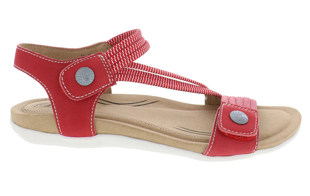 Red sandal with beige sole on a white background
