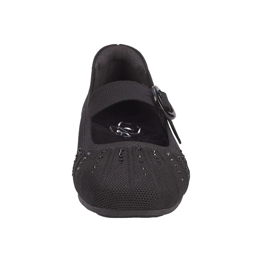 Black ballet flat shoe with a buckle on a white background