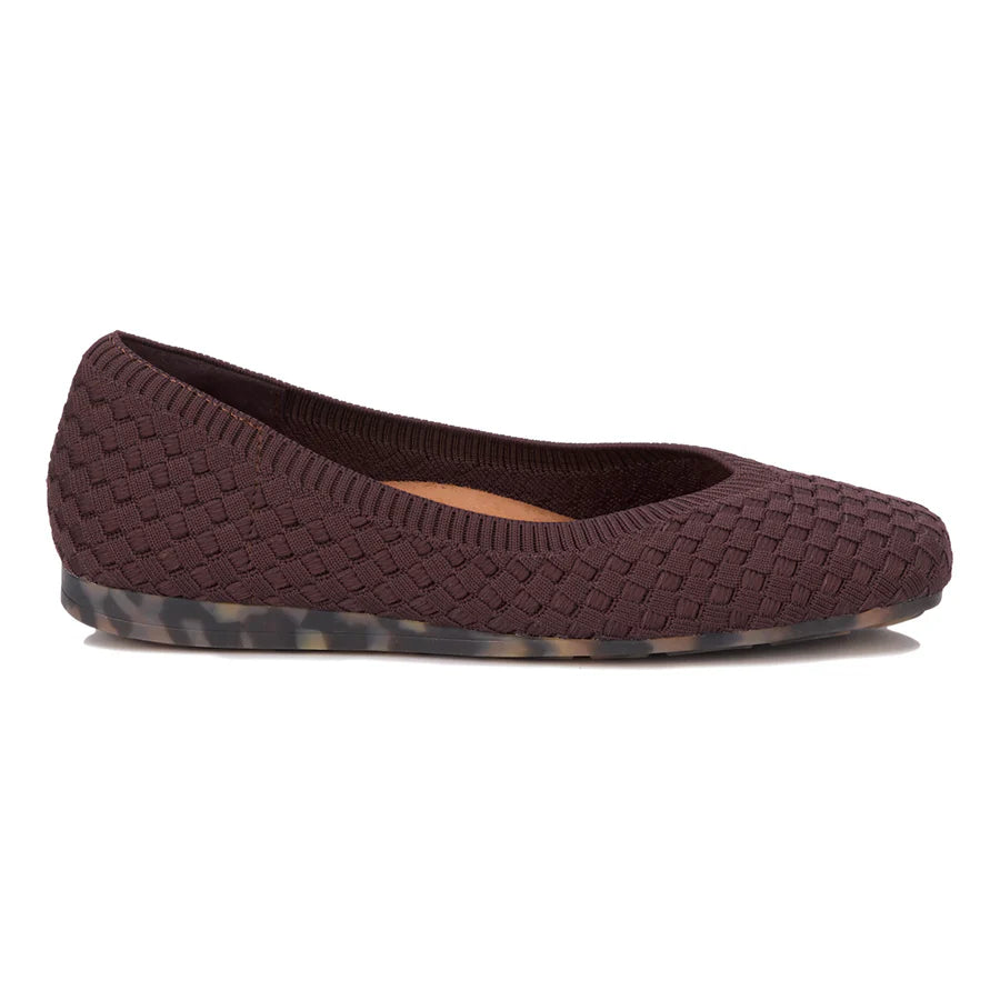 Brown woven flat shoe on a white background