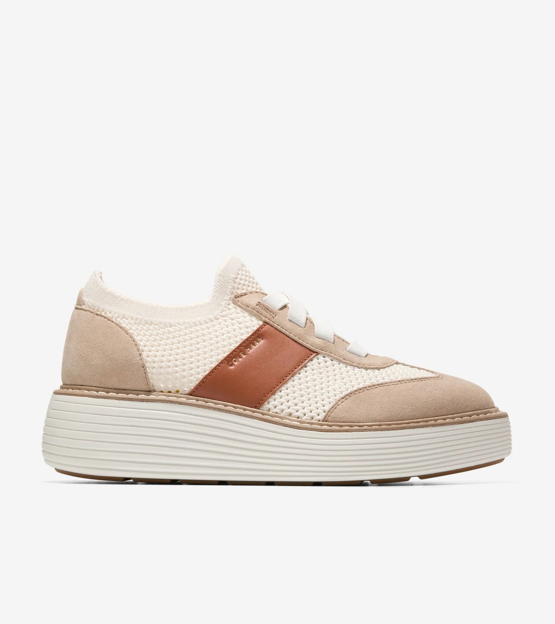 Beige and brown sneaker on a white background
