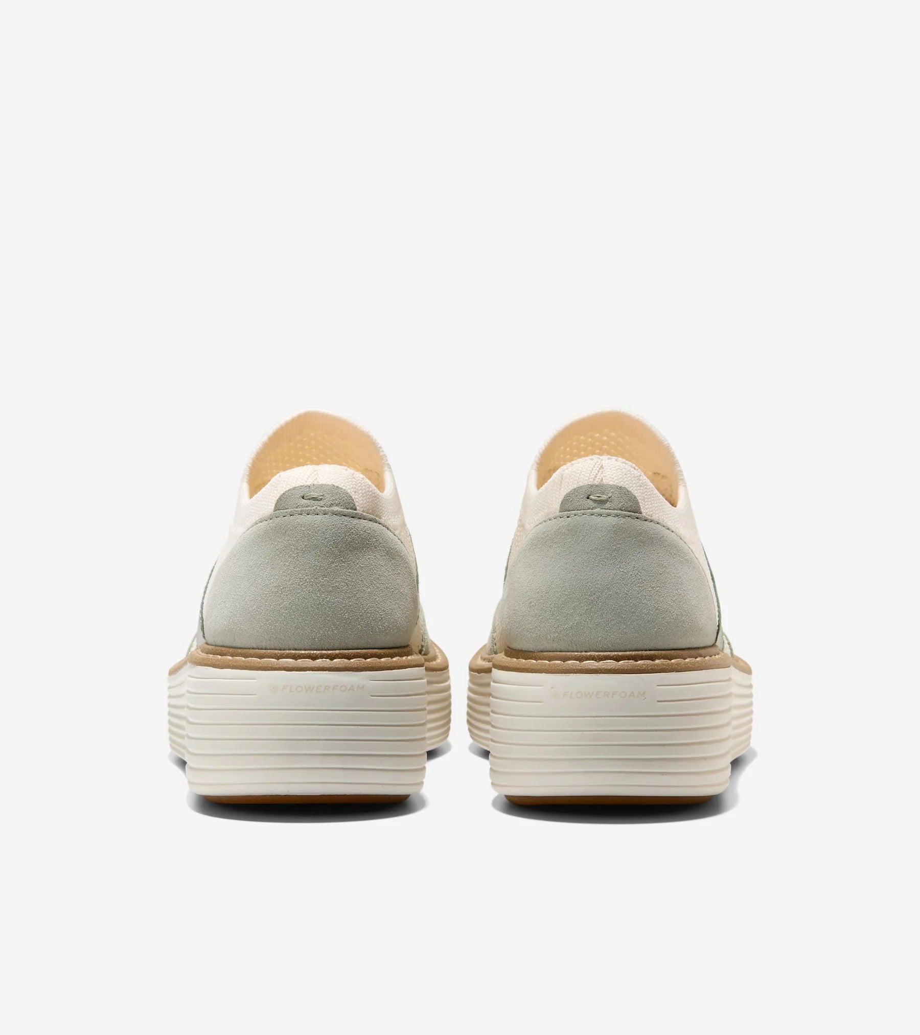 Pair of gray platform shoes with beige soles on a white background