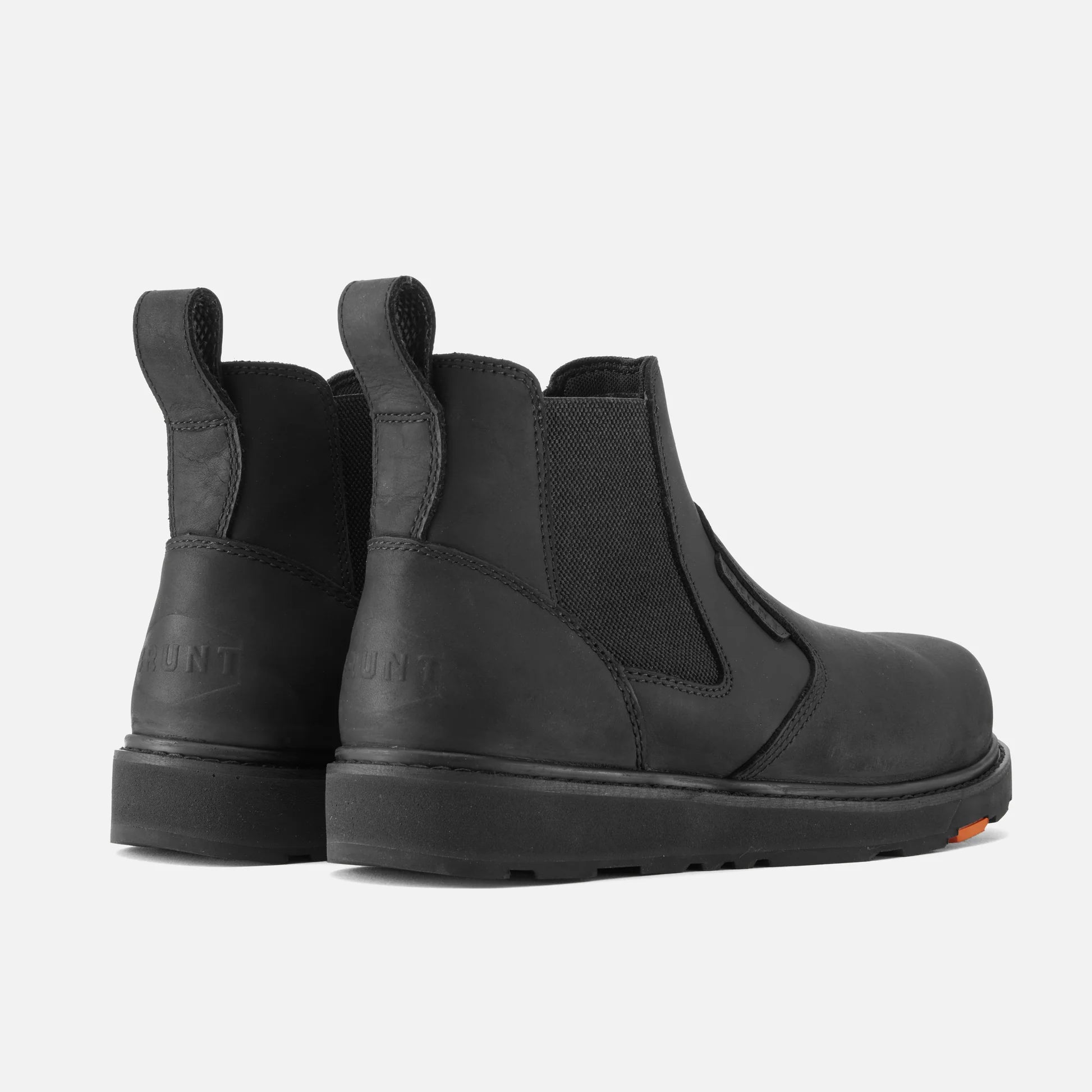Pair of black Chelsea boots on a white background