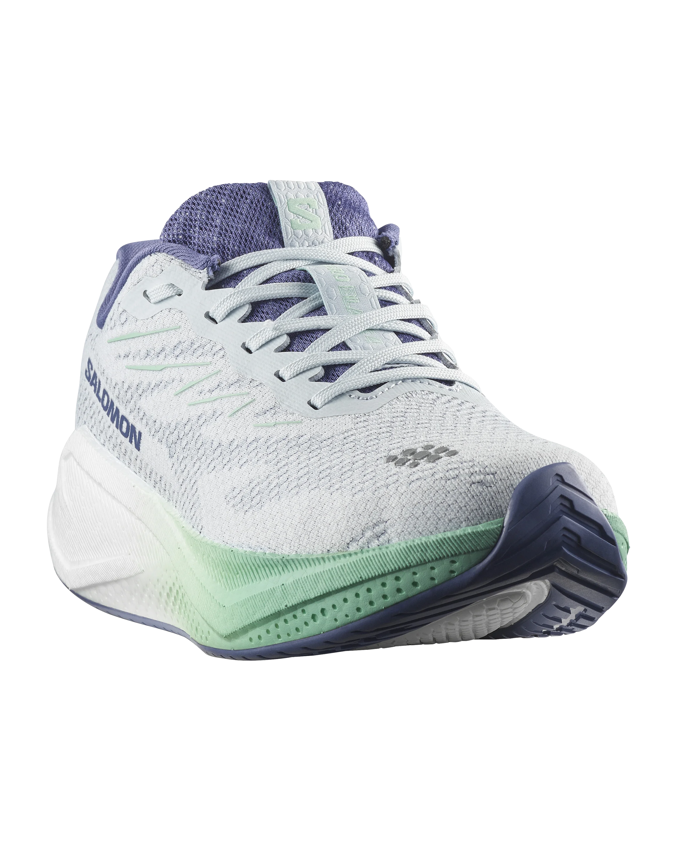 A Salomon running shoe in white and light purple with mint green accents, shown from a three-quarters angle on a white background.