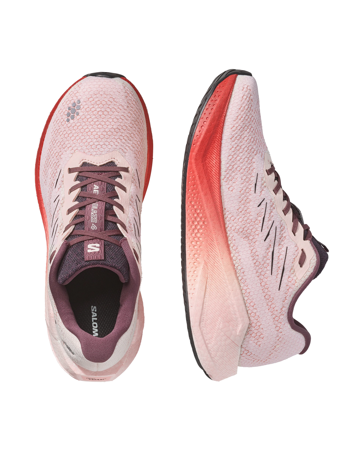 A pair of Salomon running shoes in light pink and coral red, shown from the top and side views on a solid white background.