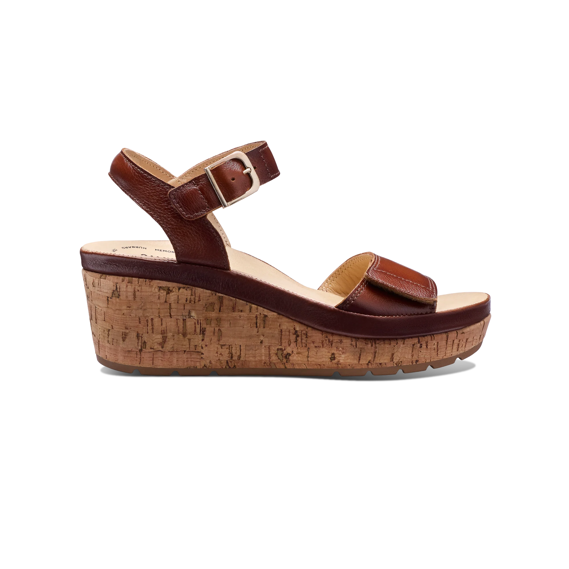 Brown wedge sandal with cork sole on a white background
