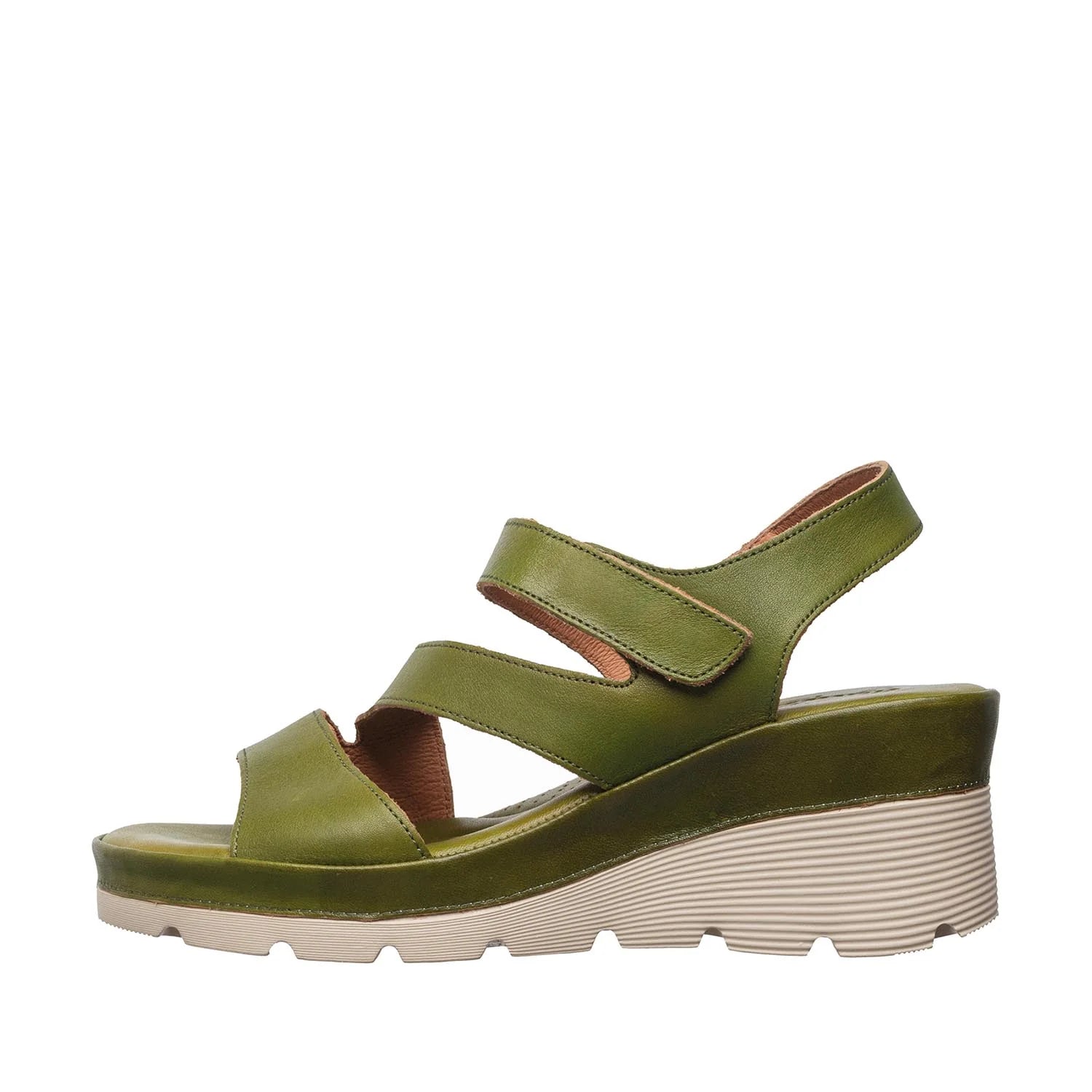 Green sandal with a thick sole on a white background