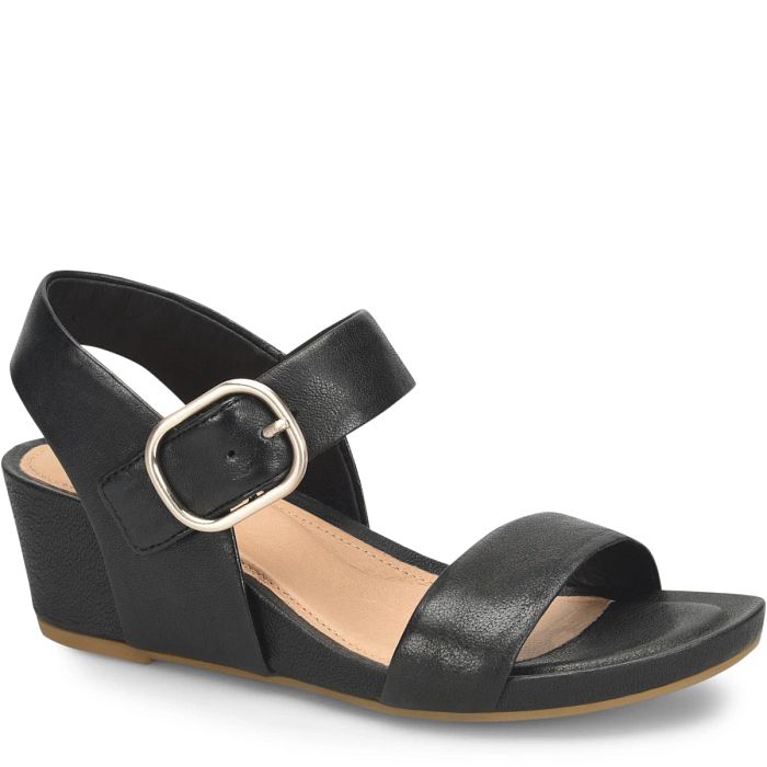 Black sandal with a gold buckle on a white background