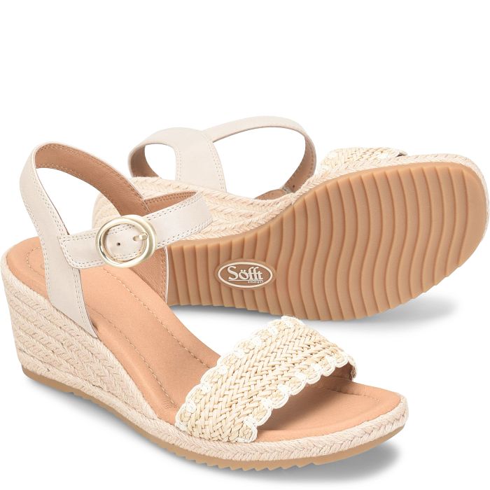 White sandal with a beige wedge sole on a white background
