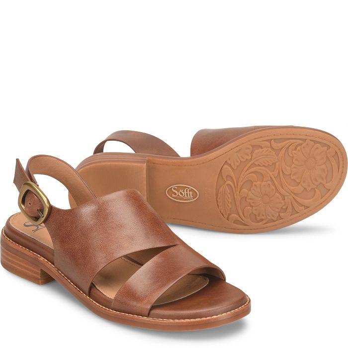 Brown sandal with a gold buckle on a white background