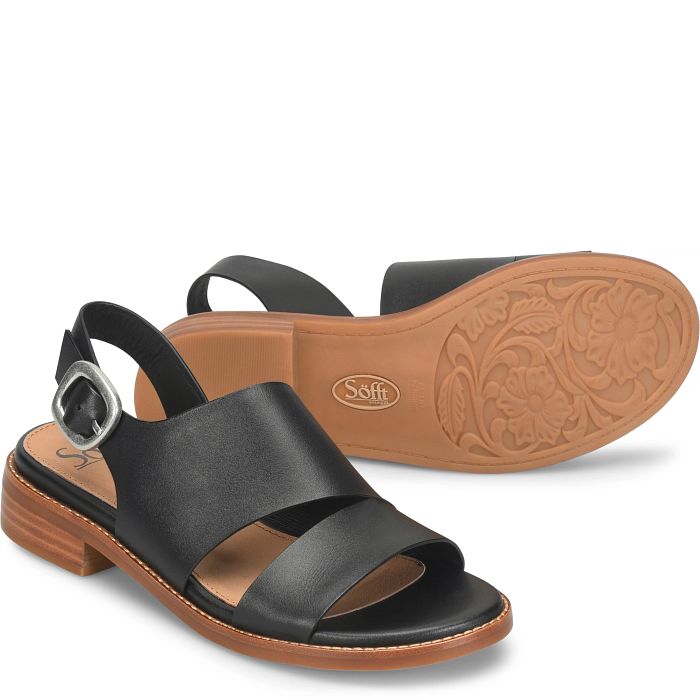 Black sandal with brown sole on a white background