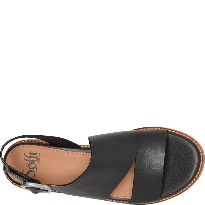 Black sandal with a brown insole on a white background