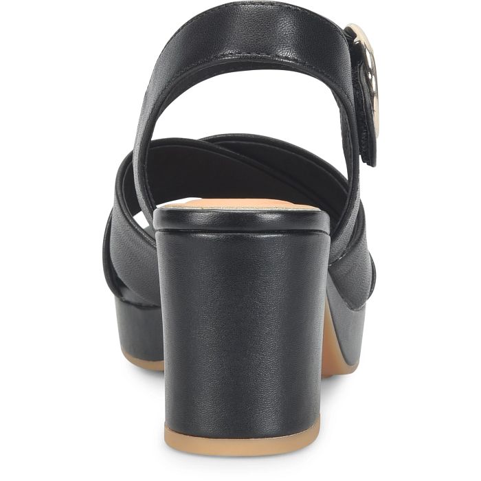 Black sandal with a strap on a white background