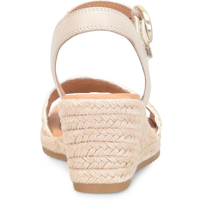 Beige wedge sandal with braided sole on a white background