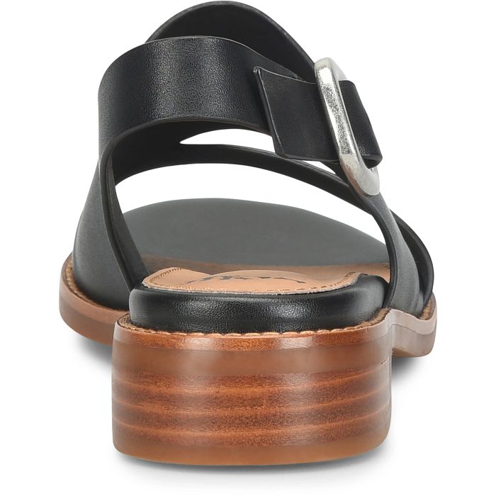 Black sandal with wooden sole on a white background