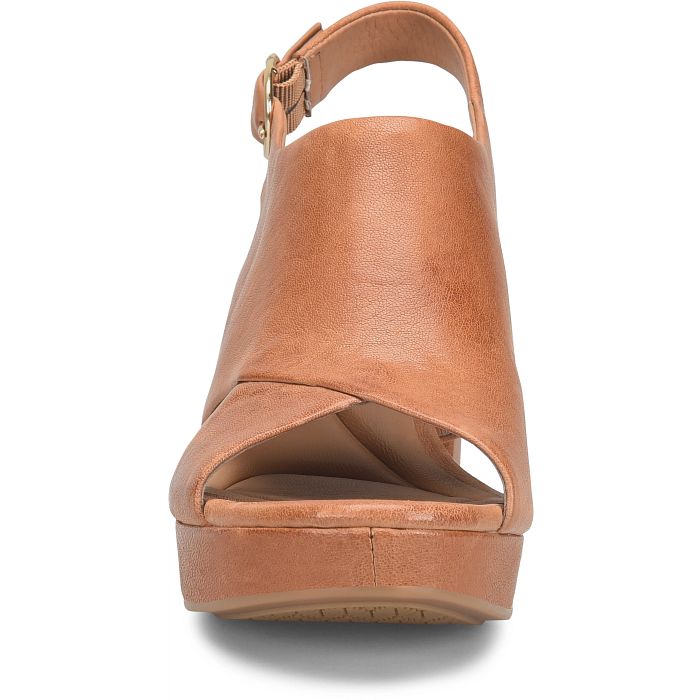 Brown wedge sandal on a white background