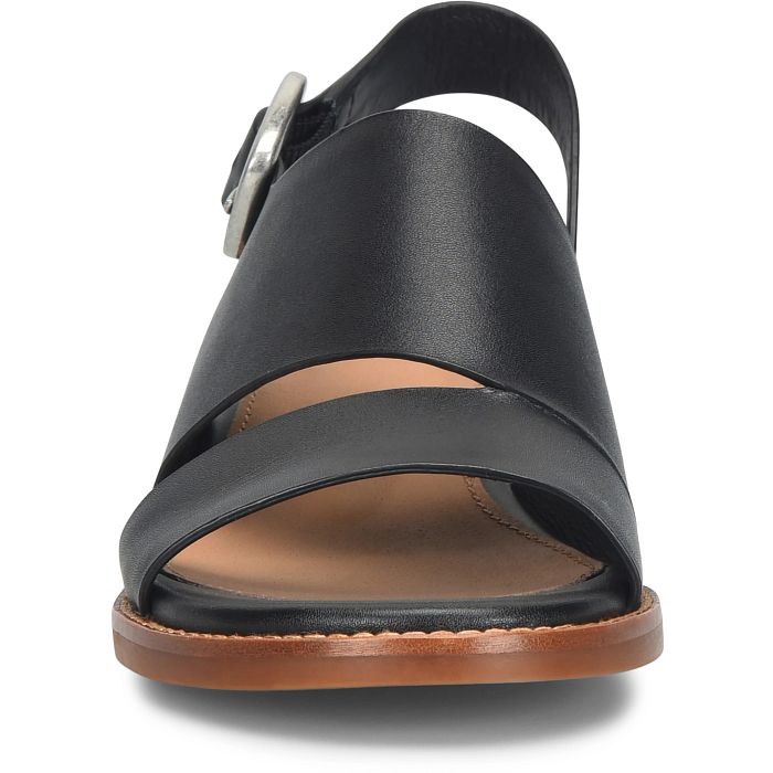 Black sandal with a brown sole on a white background