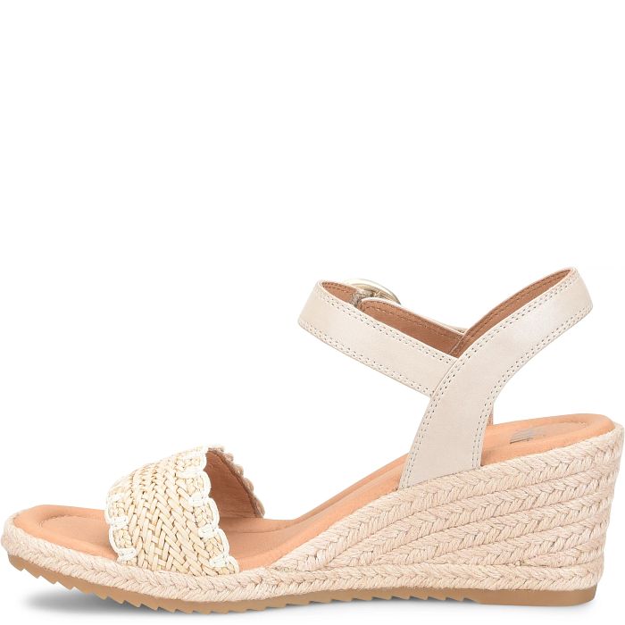 Beige wedge sandal with woven sole on a white background