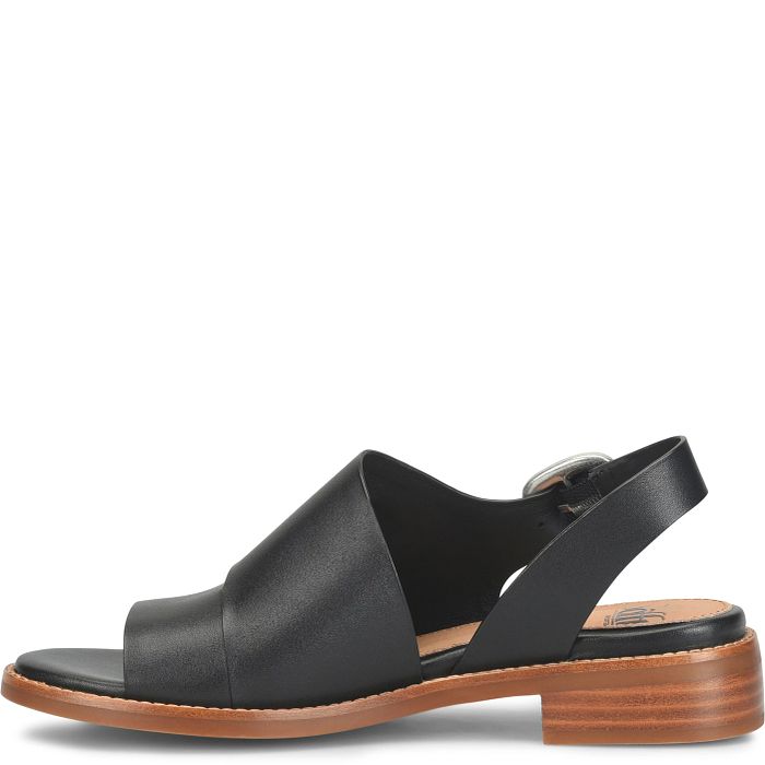 Black sandal with a brown sole on a white background
