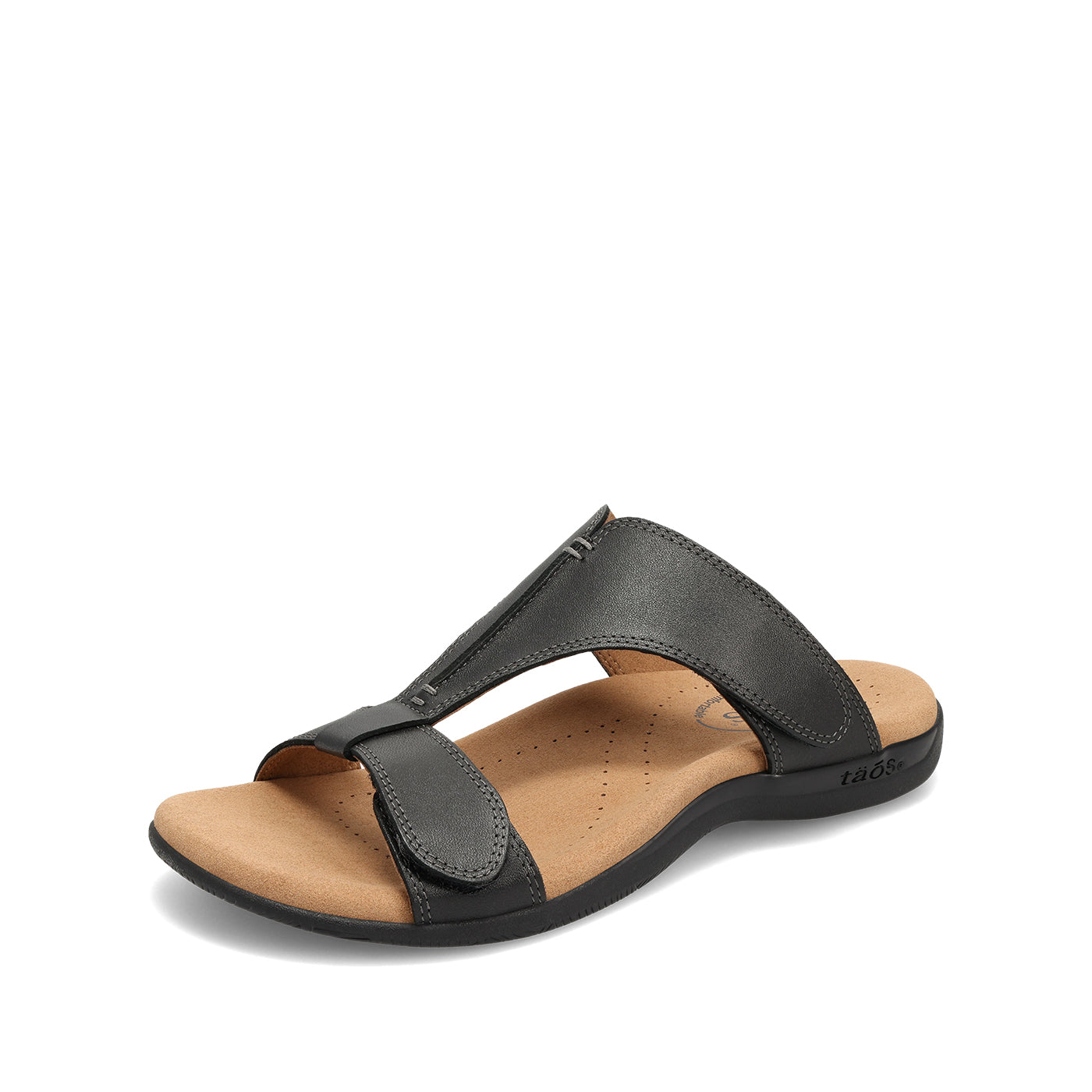 Black sandal with a tan insole on a white background
