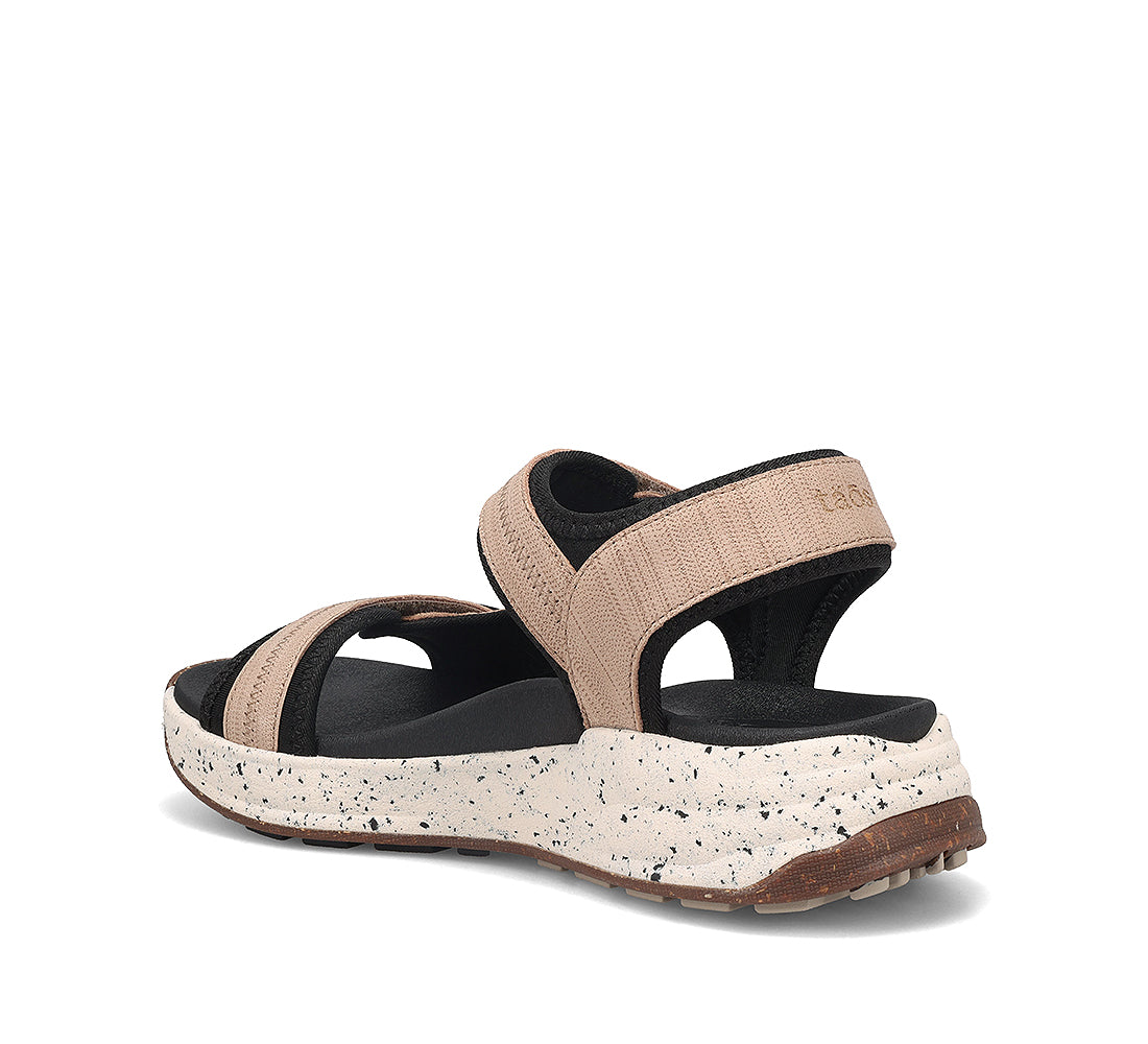 Beige and black sandal with speckled sole on a white background