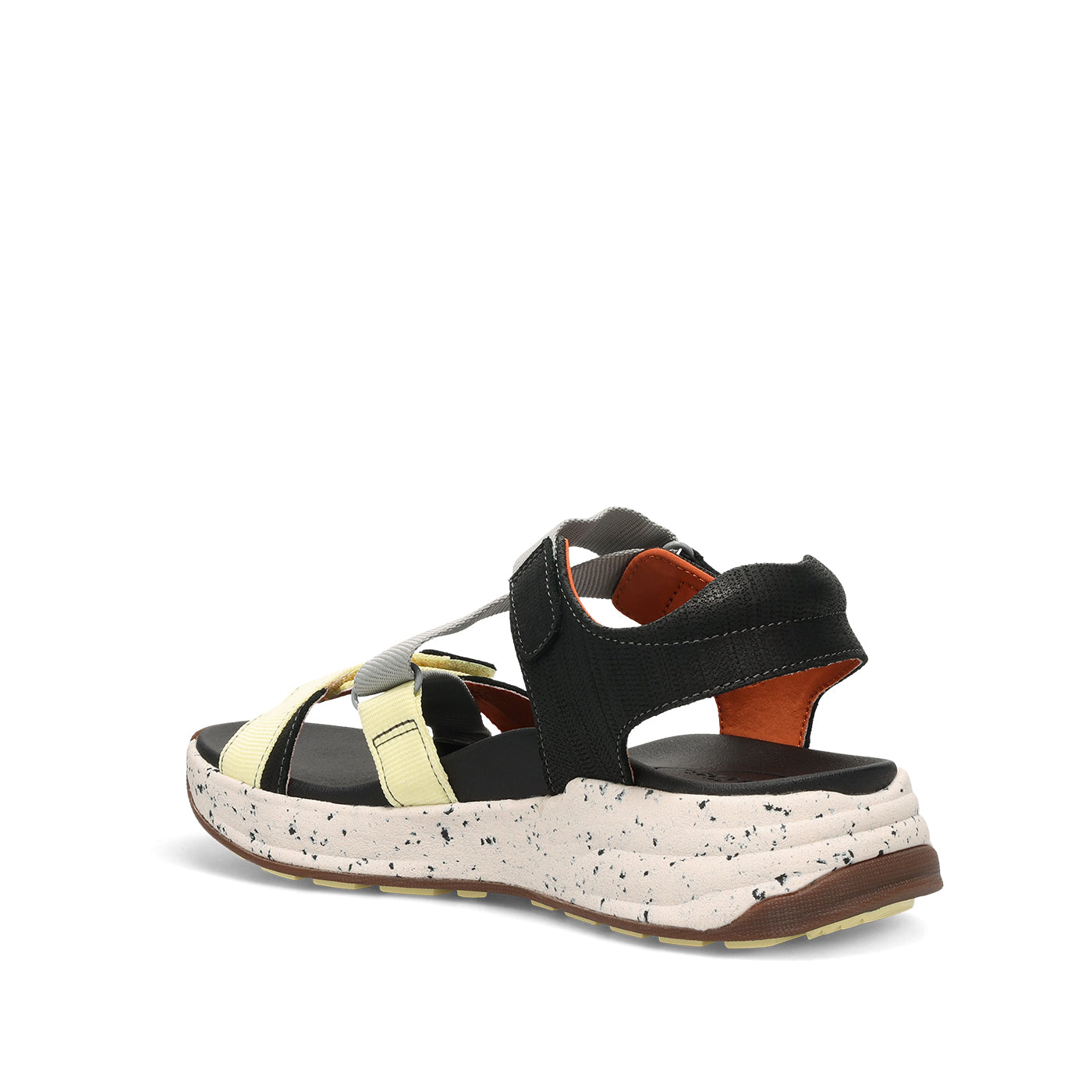 Black and beige sandal with speckled sole on a white background