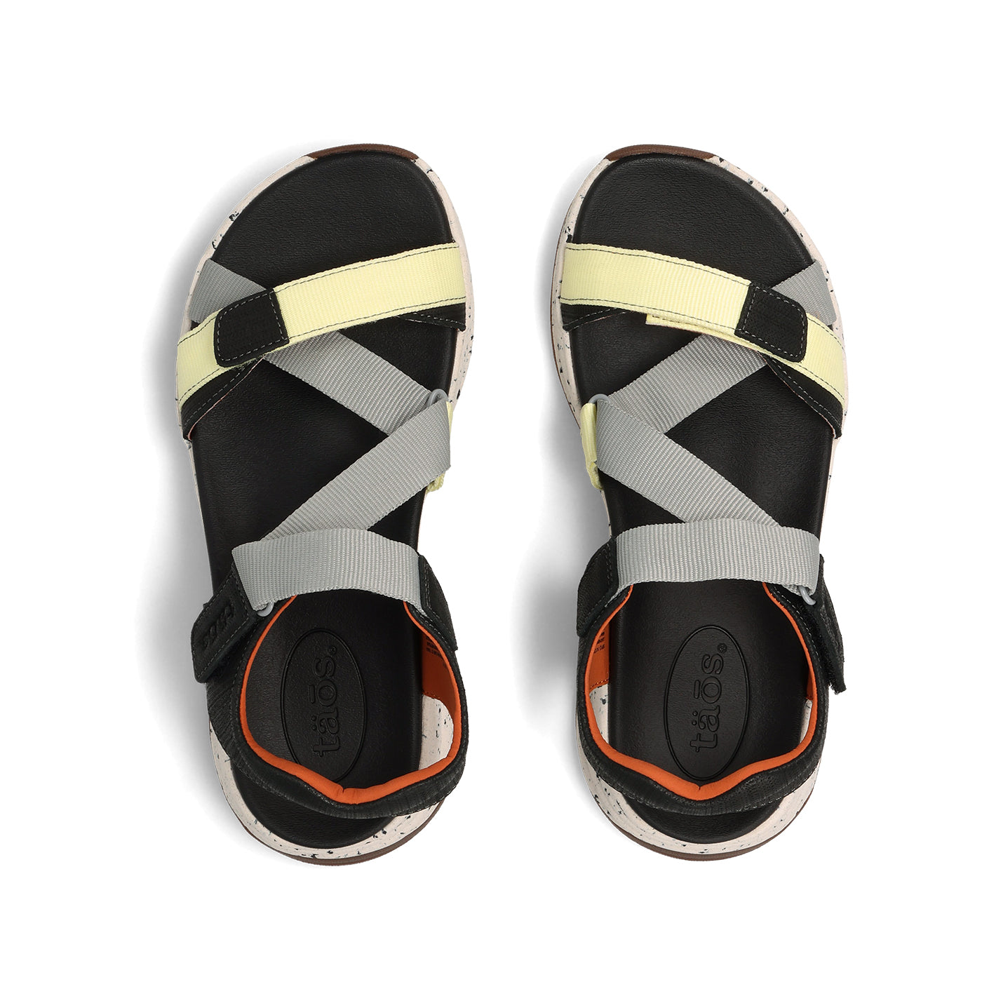 Black sandals with yellow and gray straps on a white background