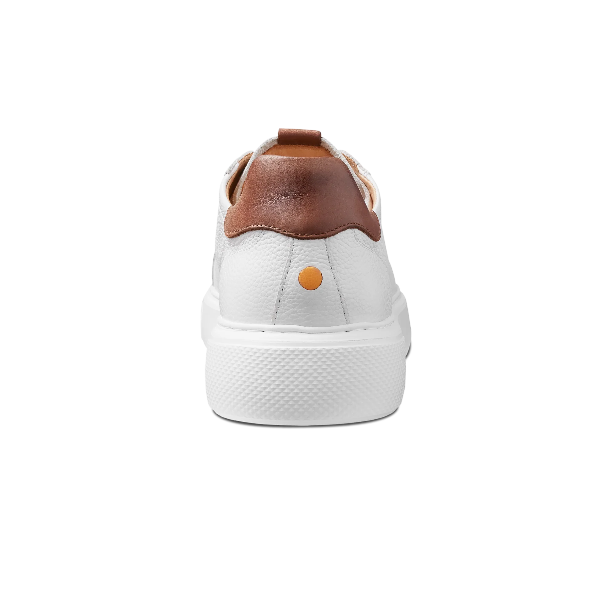 White sneaker with brown accents on a white background