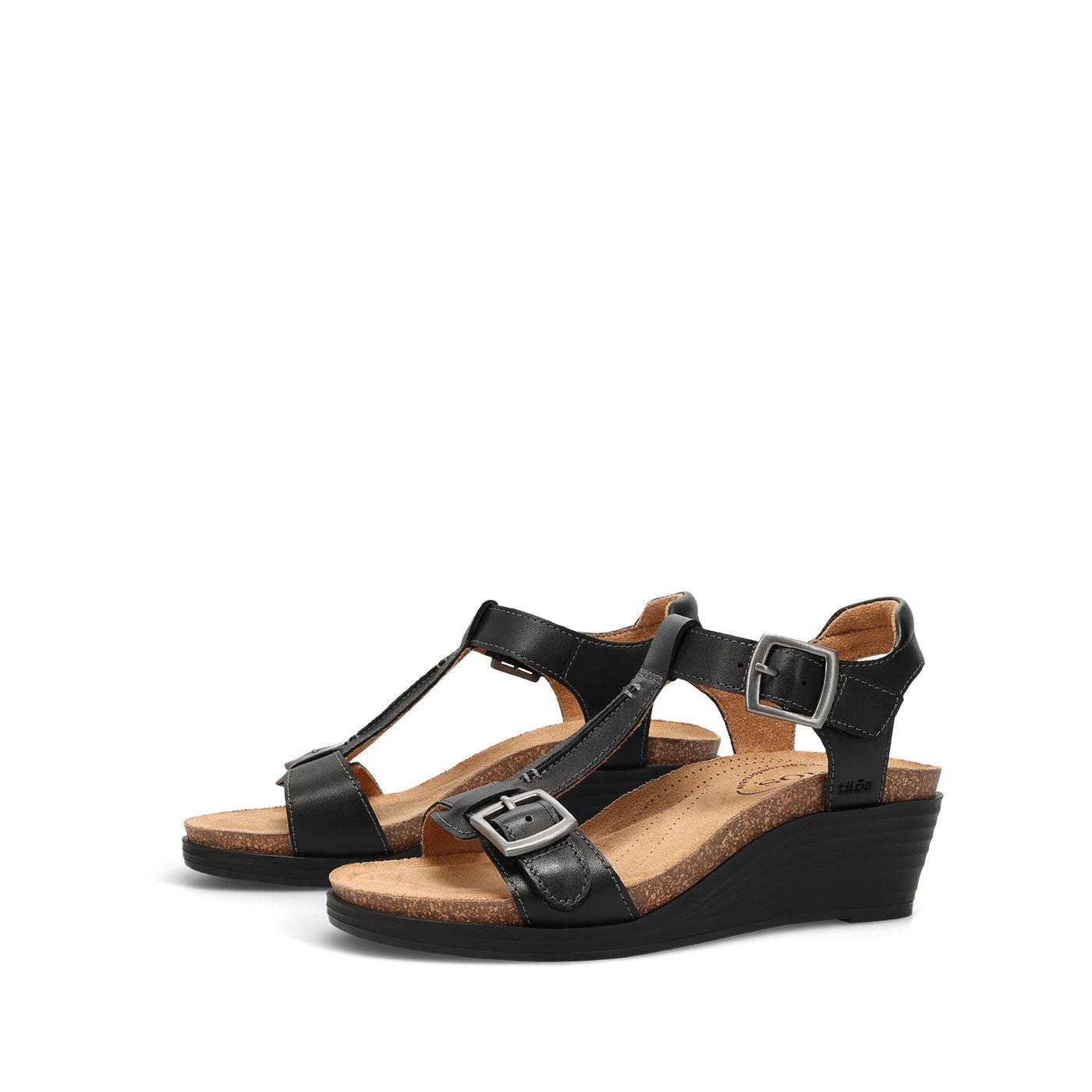 Black wedge sandals with straps on a white background