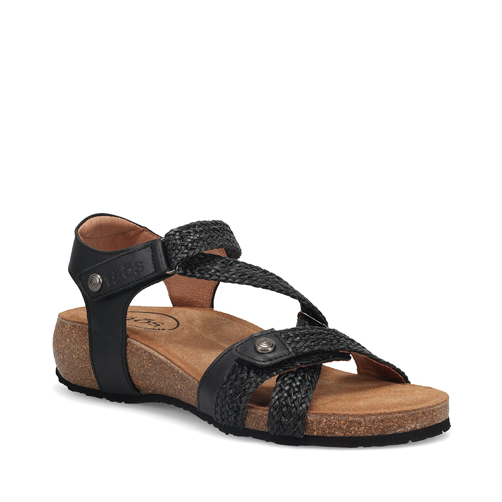 Black sandal with cork sole on a white background