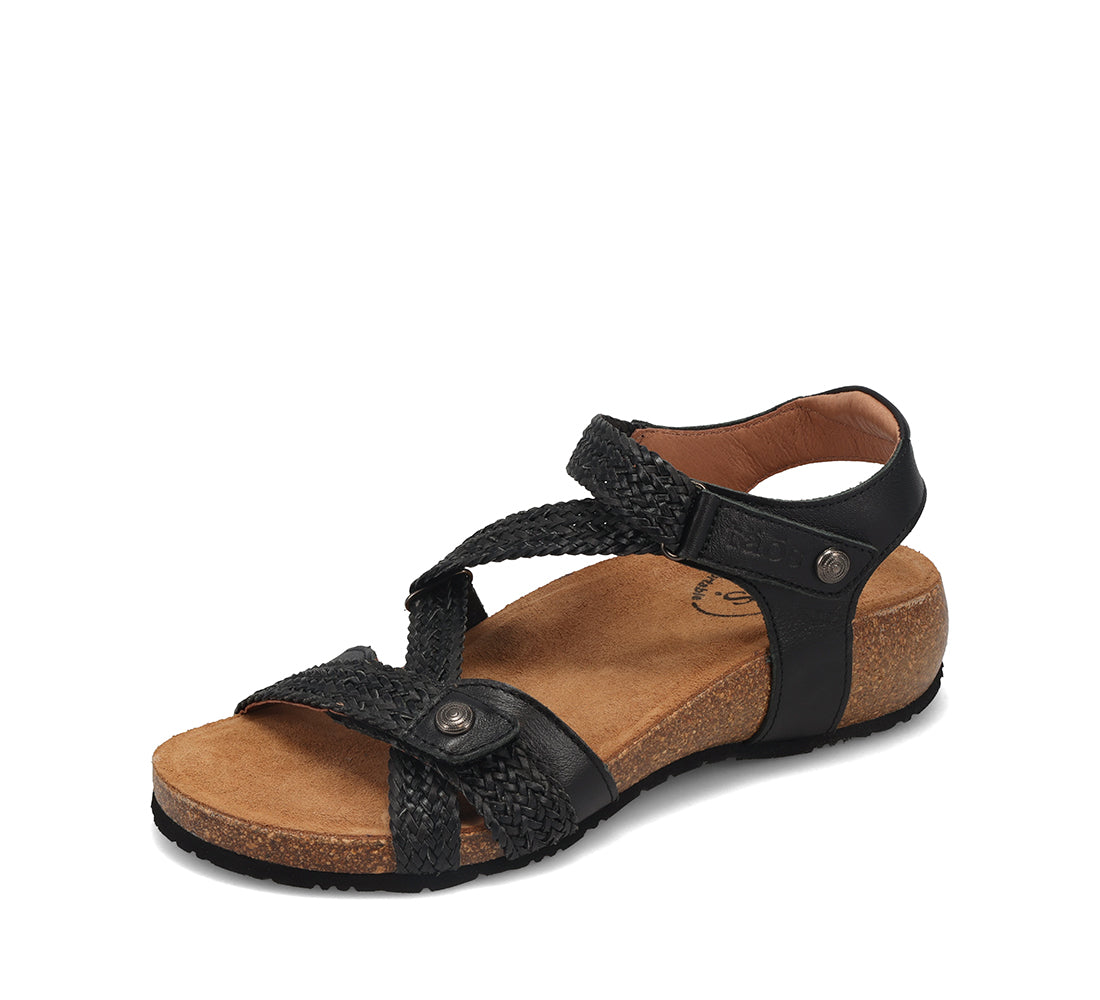 Black sandal with brown sole on a white background