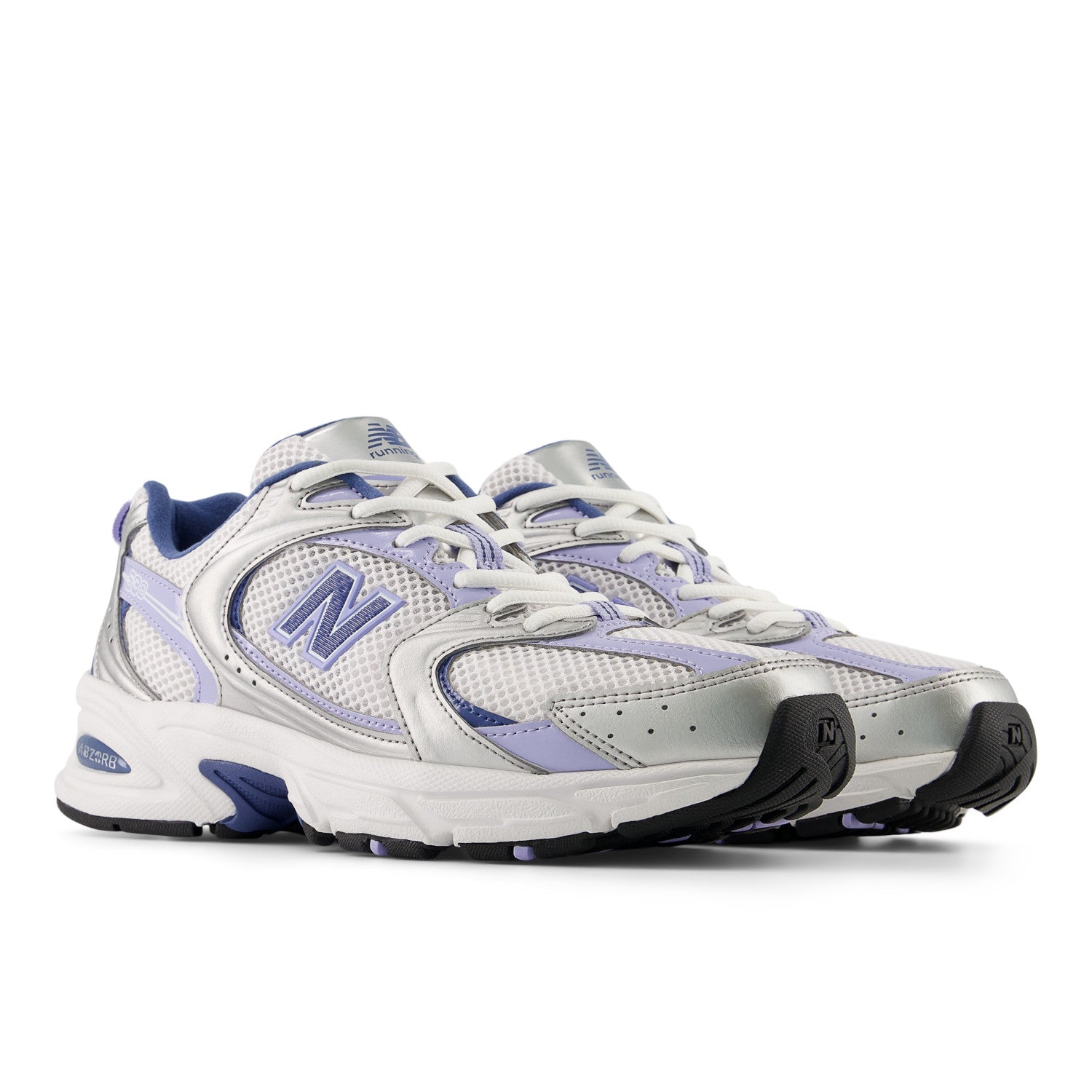 Pair of white and purple running shoes with New Balance logo on a white background