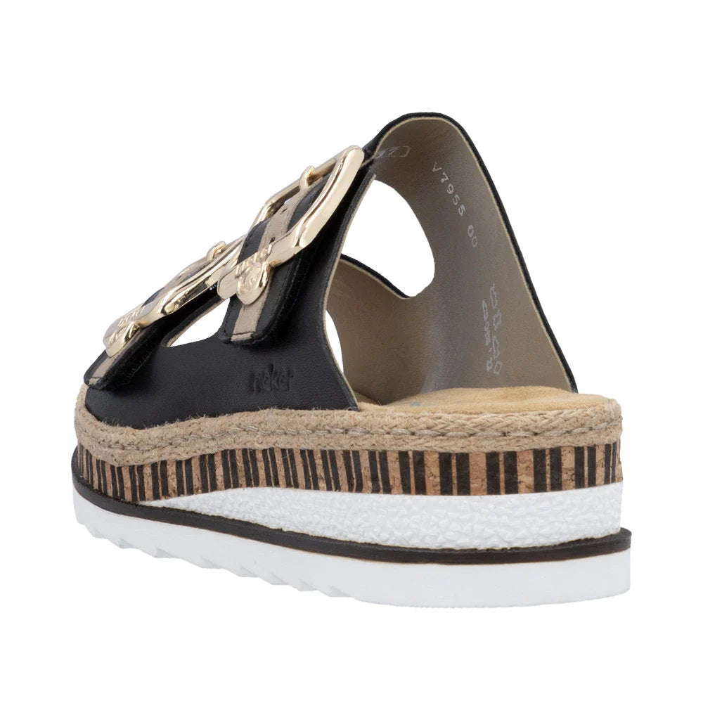 Black sandal with gold embellishments on a white background