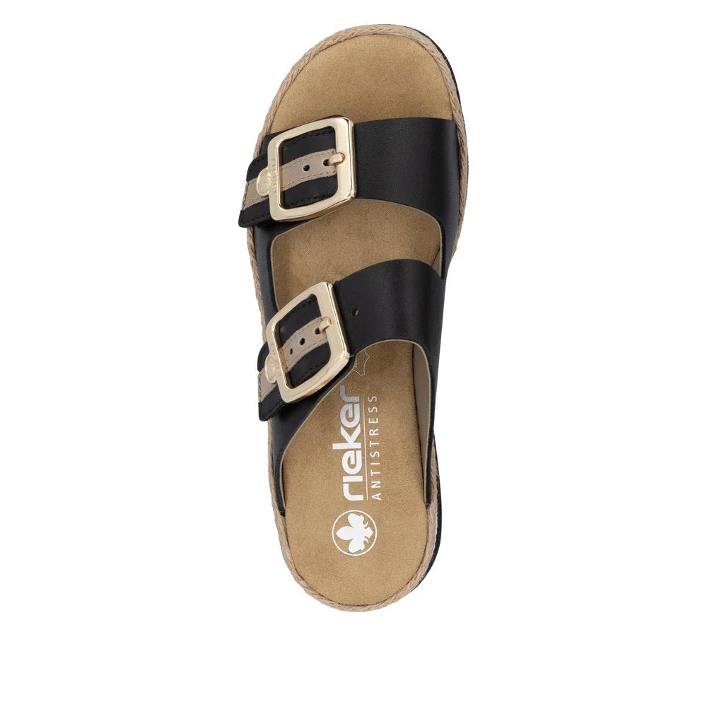 Tan sandal with black straps on a white background