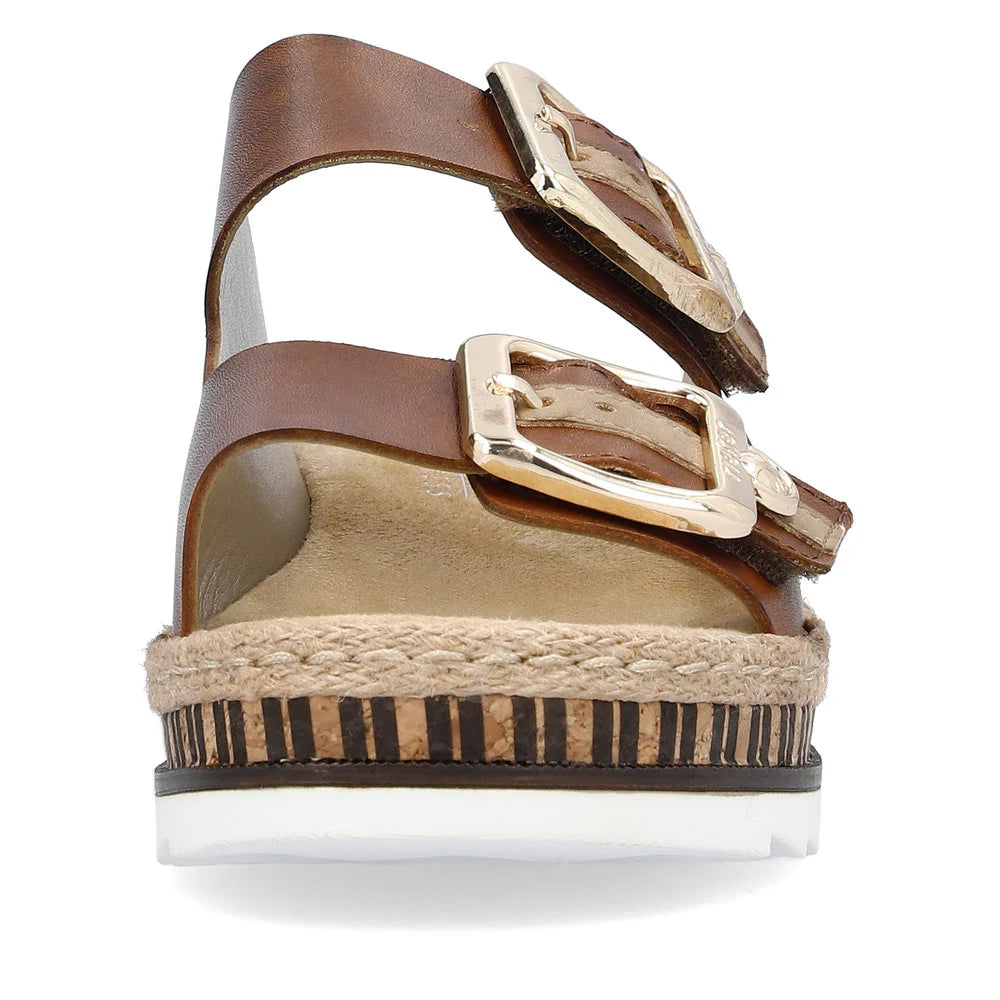 Brown sandal with gold buckles on a white background