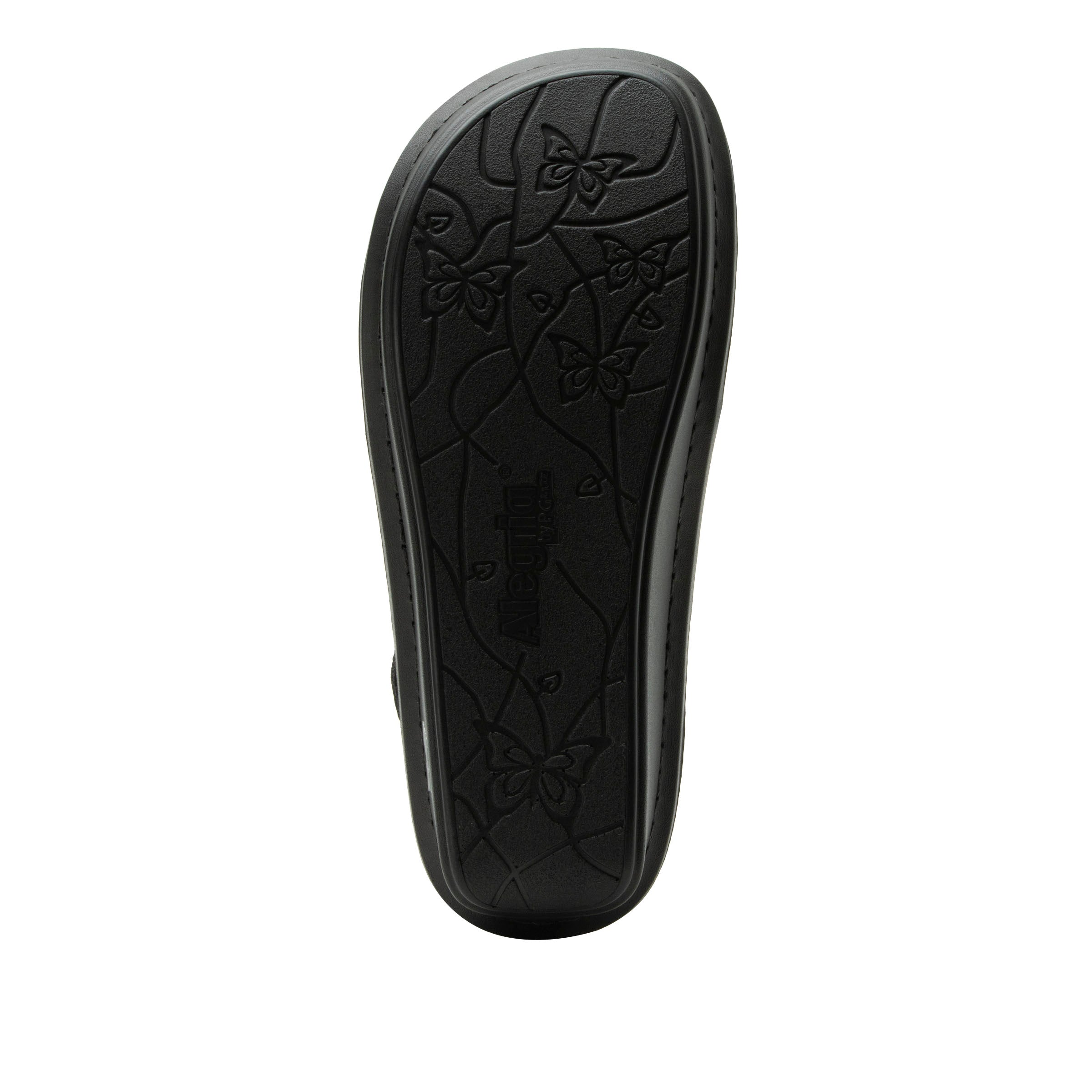 Black shoe sole with a butterfly pattern on a white background