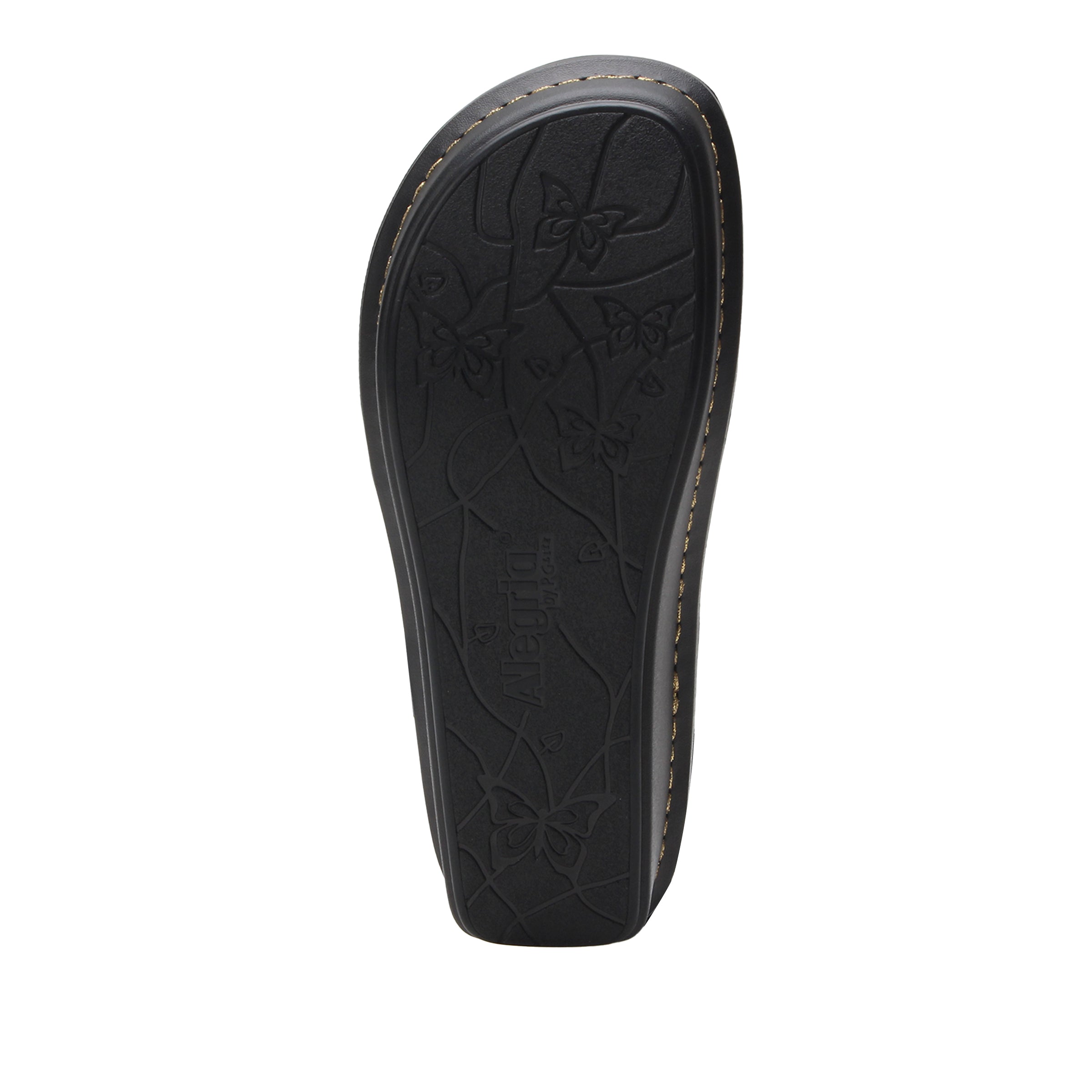 Black leather sandal sole with floral pattern on a white background