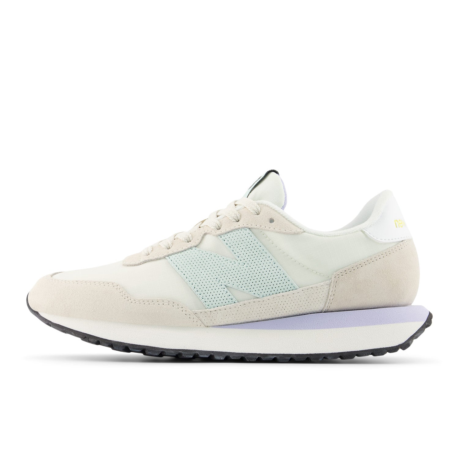 Beige sneaker with a light blue accent on a white background