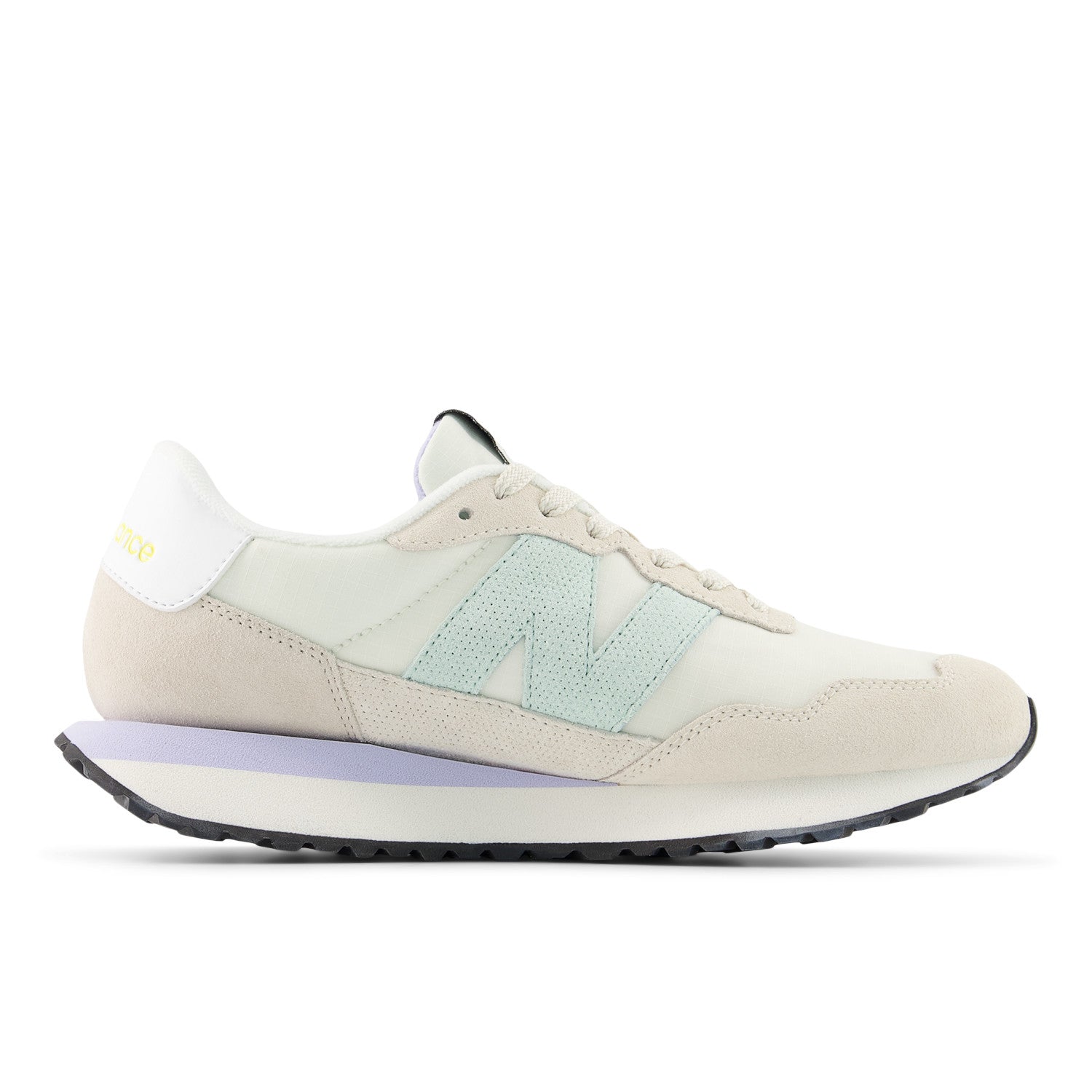 Beige sneaker with a light blue accent on a white background