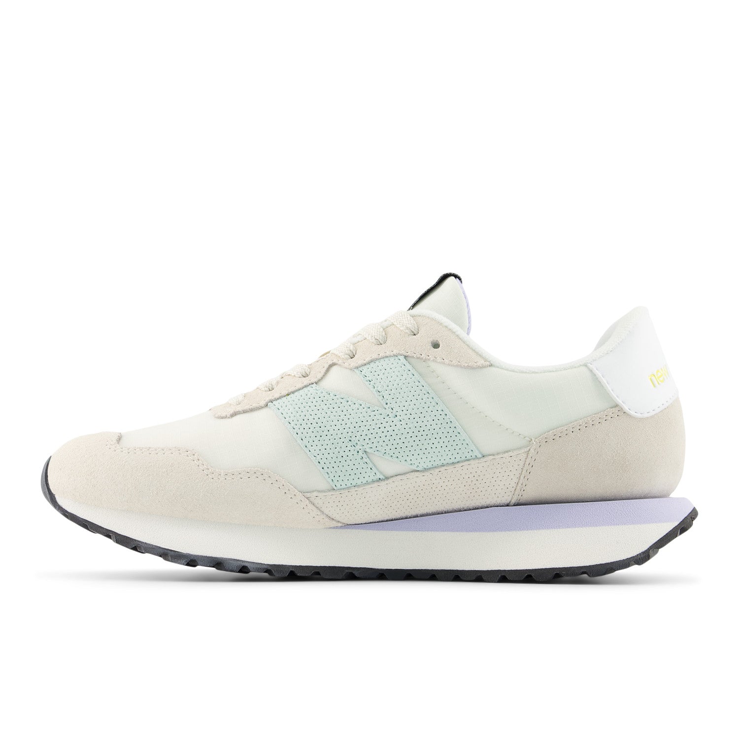 Beige sneaker with light blue accents on a white background
