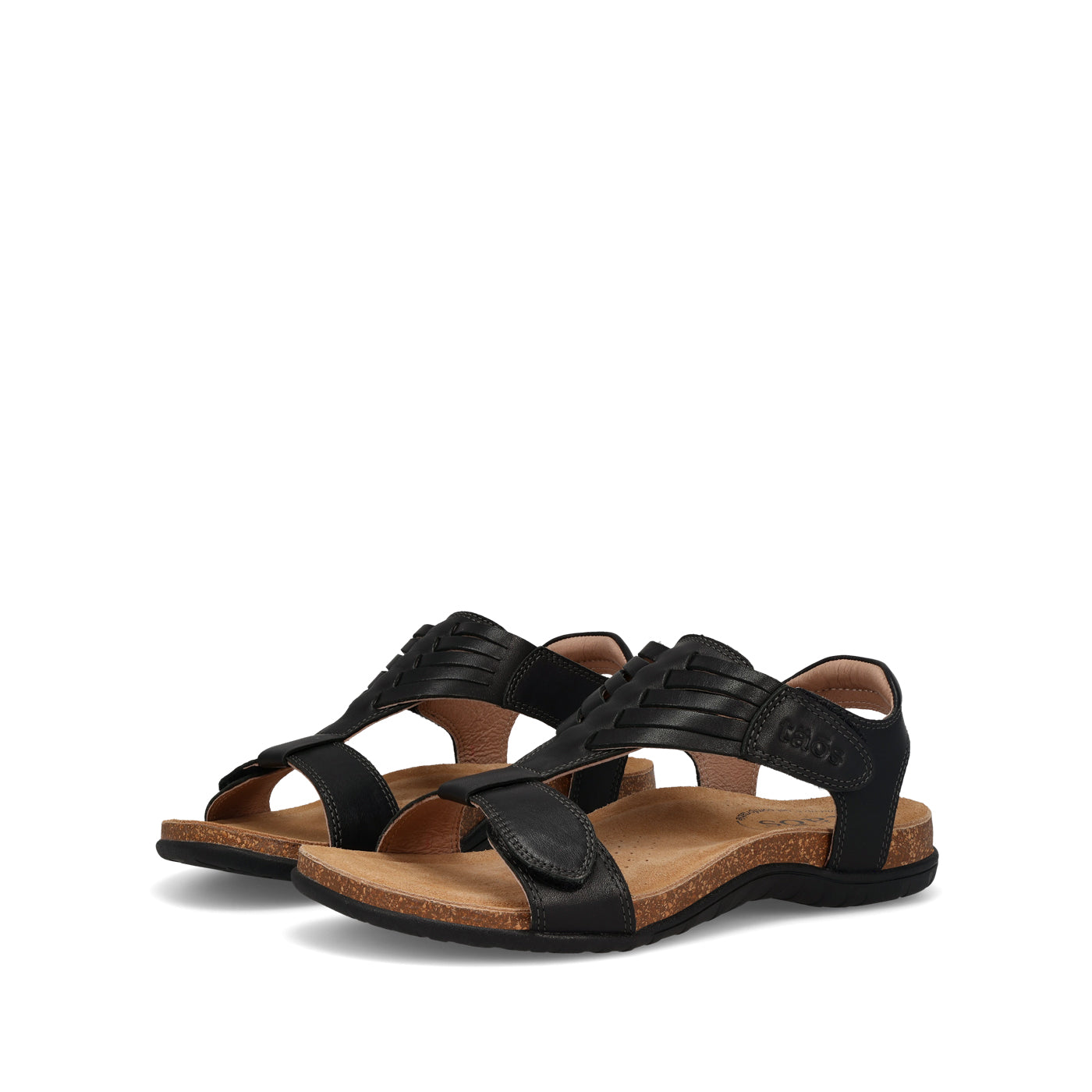 Pair of black sandals with brown soles on a white background