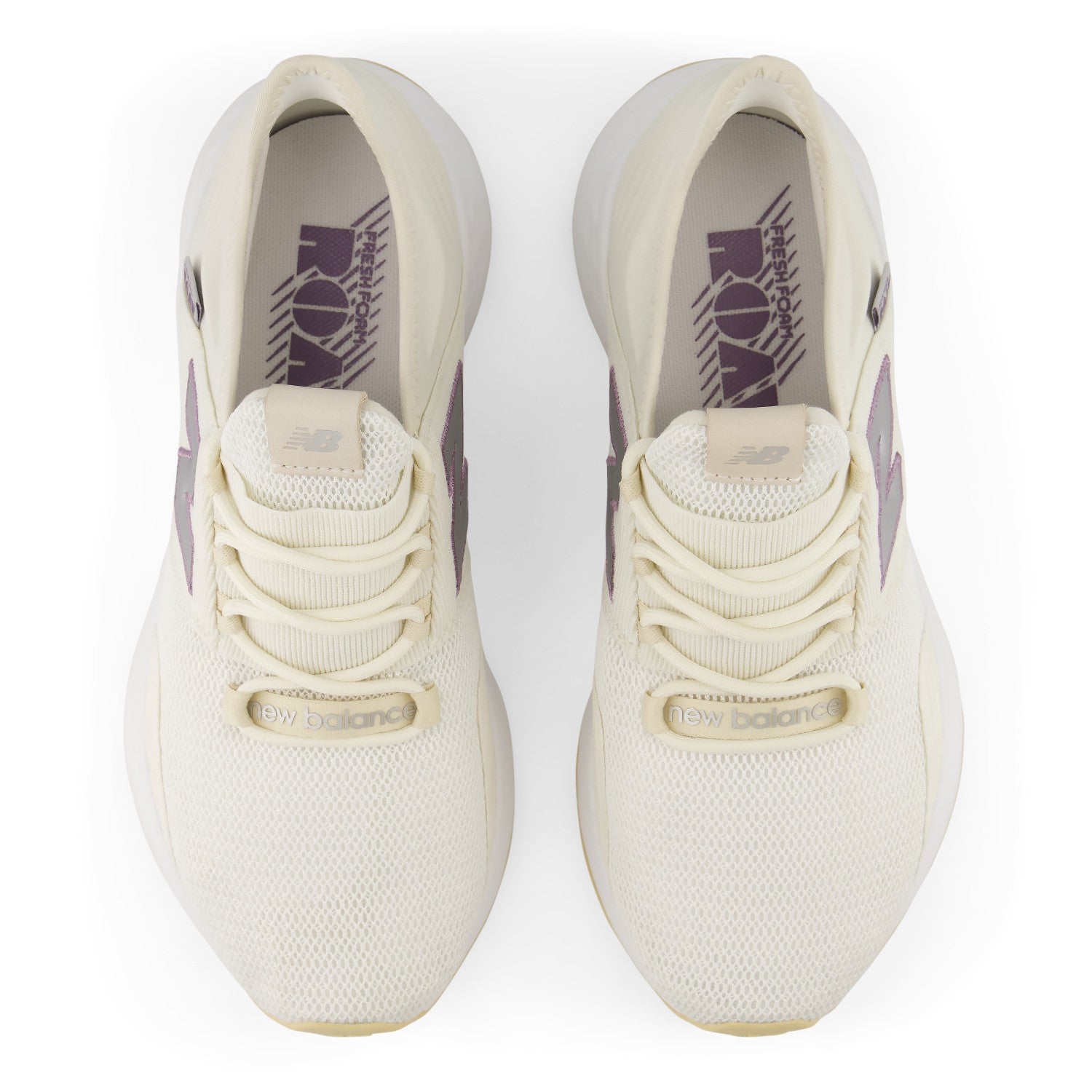 Pair of white sneakers with a visible brand logo on a white background